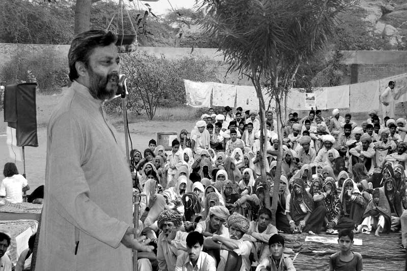 Rajendra Singh addressing a public meeting in a village in Jaipur district, Rajasthan